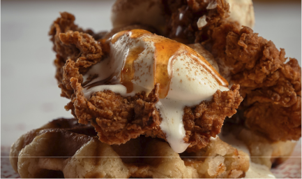 Crispy fried chicken pieces topped with sauce from Chooks Fried Chicken, Edinburgh